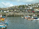 Porthleven inner harbour and Harbour Inn. 25 May 2003.